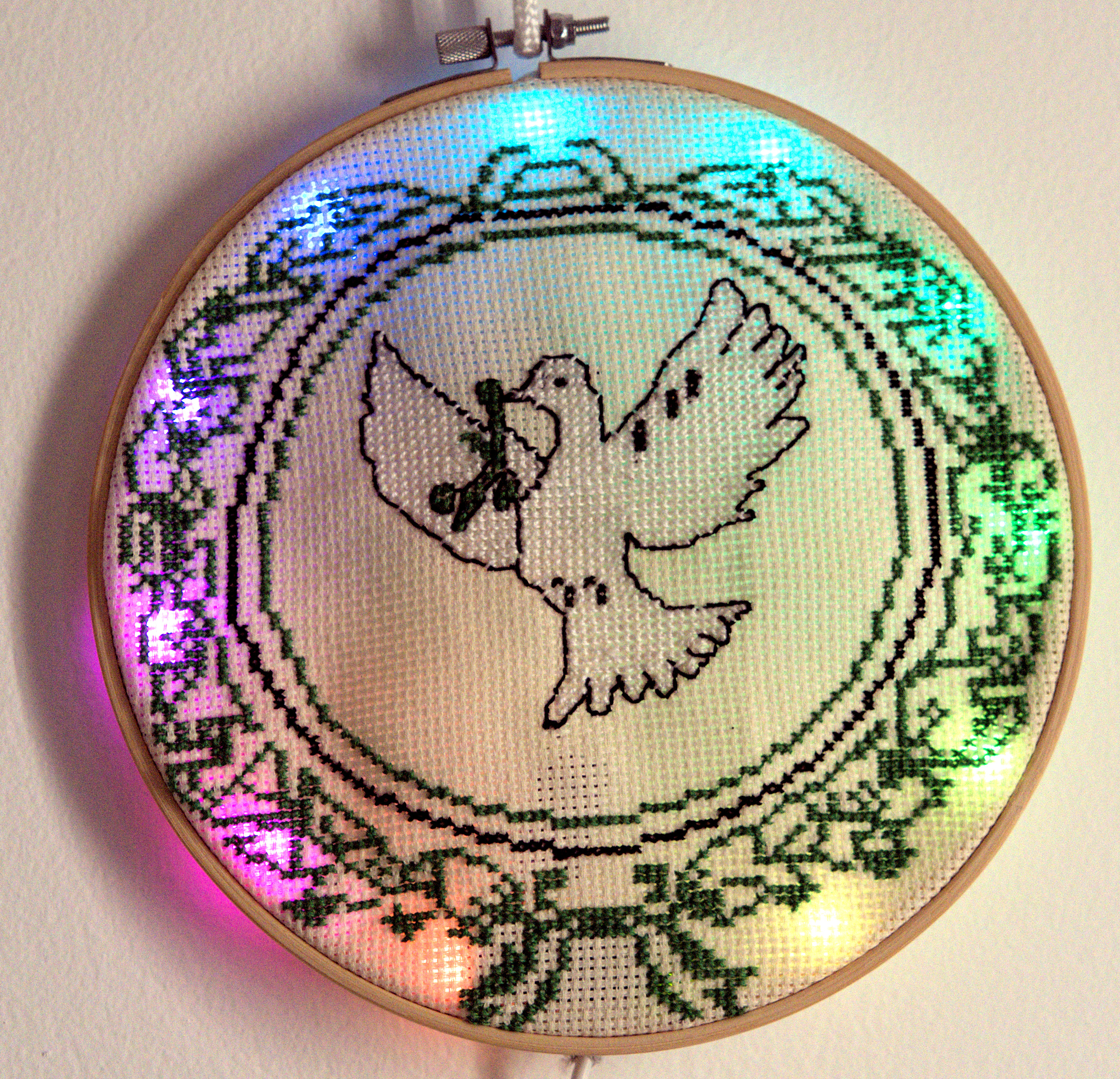 Embroidarhythm with a peace dove pattern